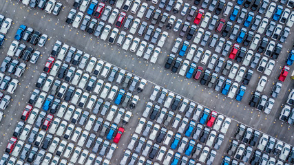 Wall Mural - Aerial view new cars lined up in the port for import and export, Top view of new cars lined up outside an automobile factory for import & Export.