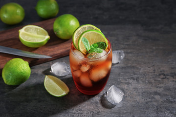 Poster - Glass of Cuba Libre cocktail on table