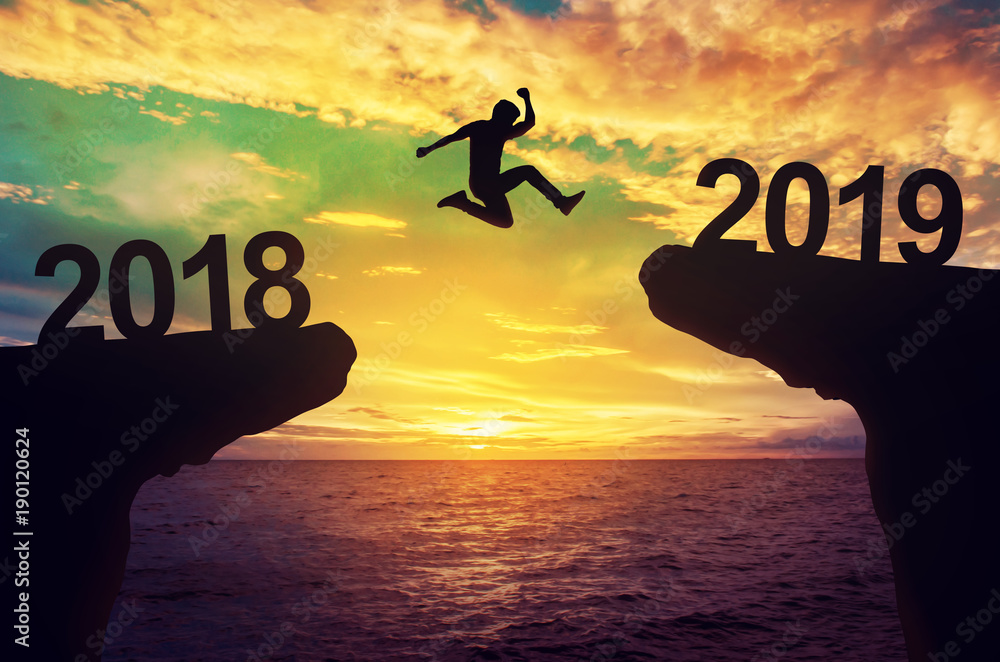 A man jump between 2018 and 2019 years. - obrazy, fototapety, plakaty 