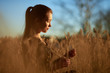 © Oleksiy - Happy pretty girl in field at sunset .Art photo