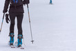 woman with a backpack going on skiing in the snow