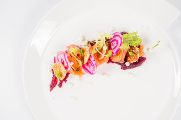 Sticker - Smoked salmon with roasted beetroots sauce, russian pancakes and horseradish cream