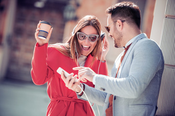 Romantic young couple sharing and listening to music