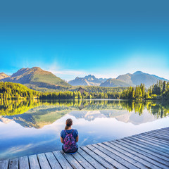 Wall Mural - Woman by lake in nature. Strbske, High Tatras