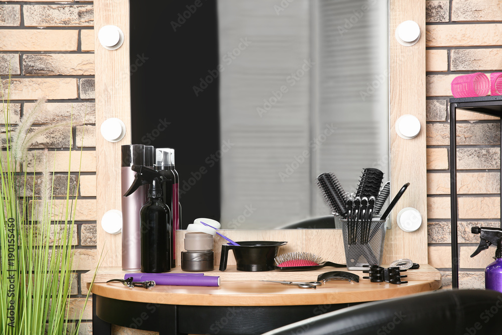 Professional hairdresser set on table in salon