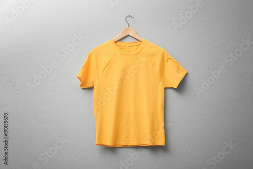 Yellow t-shirt on light background. Mock up for design - Buy this stock photo and explore ...