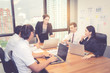 © NT_studio - Group of young business team with woman manager standing leader meeting in conference room at modern coworkers office, teamwork and business concept.