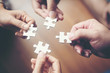 © Johnstocker - Hand holding jigsaw puzzles, Business partnership concept.