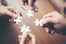 Hand Holding Jigsaw Puzzles, Business Partnership Concept.