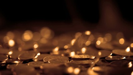 Wall Mural - Close up money coin falling to the floor in dark light , business and financial for a  money saving or investment background concept with black copy space , extremely close up and shallow DOF