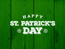 Happy St. Patrick's Day Text Over Green Wood Texture Background