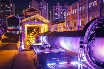 Factory buildings and industrial equipment in the evening