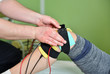 © dobok - Electronic appliance: electronic therapy on knee