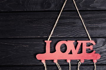 Valentines Day background. Red wooden word LOVE on wood backdrop