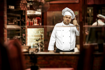 Wall Mural - Cook chef in his own small business of restaurant. 