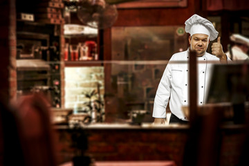 Wall Mural - Cook chef in his own small business of restaurant. 