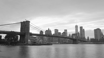 Sticker - NEW YORK CITY - OCTOBER 25, 2015: Downtown Manhattan from Brooklyn Bridge Park. The city attracts 50 million people every year