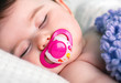 Sleeping Baby with a Pacifier in his Mouth