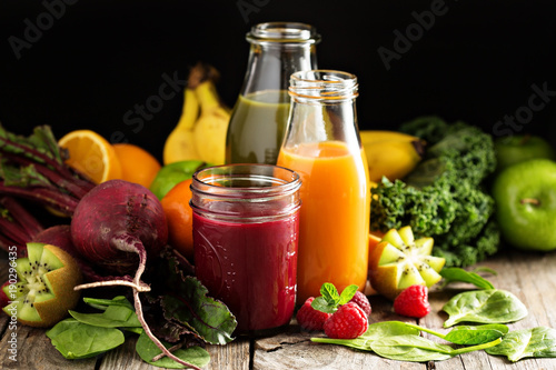 Fotografie, Obraz Fresh vegetable and fruit juices with beets, berries and greens
