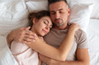 © Drobot Dean - Top view of pretty loving couple sleeping together in bed