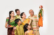 Indian family celebrating Gudi Padwa or Ugadi festival, which is a new year in Hindu tradition
