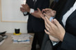 © 88studio - cheerful businessman applauding at conference. successful business team clapping hands for great work
