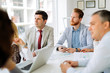 © NDABCREATIVITY - Business people discussing future plans