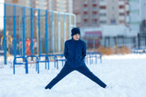 Fototapeta Młodzieżowe - young boy takes exercises at the winter stadium