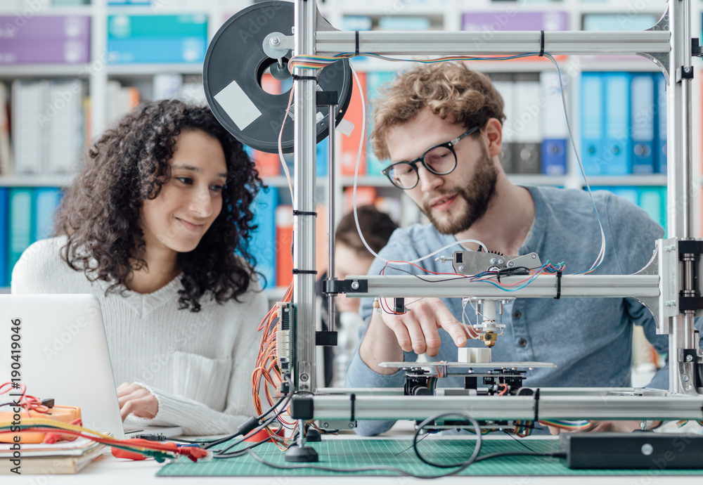 Engineering students using a 3D printer Stock Photo | Adobe Stock