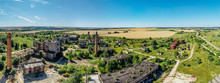 Aerial Panoramic View Of Abandoned Industrial Area At Rural Landscape, Concrete Buildings, Industry And Agricultural District