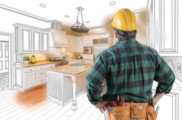 Wall Mural - Male Contractor with Hard Hat and Tool Belt Looking At Custom Kitchen Drawing Photo Combination On White.