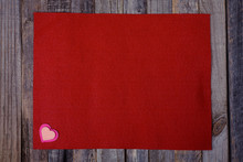 Red Fleece With Hearts On Wooden Background