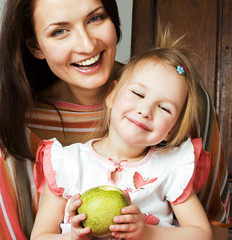 Portrait of mother and daughter at home, happy smiling family, l