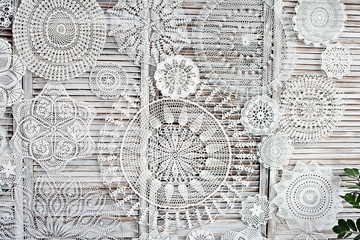 Fototapeta Macrame made by hands. Panel with needlework. Beautiful white patterns with your own hands.