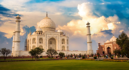 Fototapete - Taj Mahal Agra India historical monument at sunrise with moody sky.
