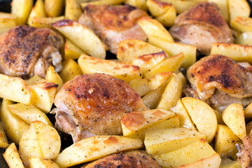 Potatoes with chicken baked in the oven. Delicious dish for dinner.