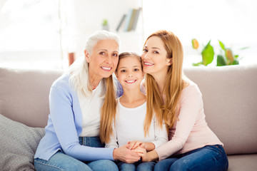 Poster - Motherhood parenthood people tenderness gentle comfort international women's day concept. Portrait of adorable beautiful cute sweet mom granny preteen sitting on sofa in room