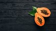 Papaya. Tropical Fruits. On a wooden background. Top view. Copy space.