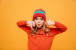 © Drobot Dean - Funny Young girl in hat showing thumb up and down
