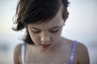 © Gregory Miller - Close-up of girl standing at beach