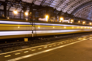 Wall Mural - Train with speed on station Haarlem