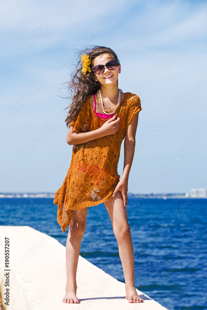 portrait-of-a-charming-teenage-girl-posing-on-the-camera-smiling-and