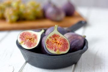 Wall Mural - Fresh and ripe figs in a frying pan.