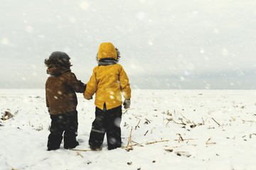 two boys on frozen sea