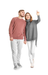 Sticker - Young couple in casual clothes walking on white background