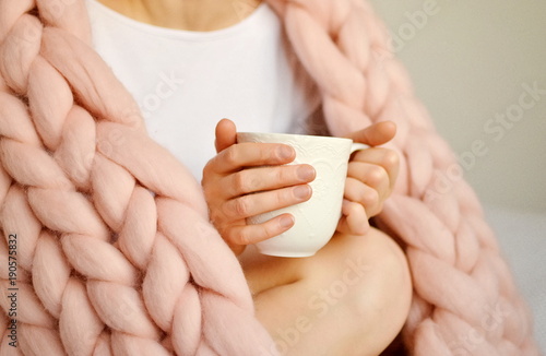 Young Woman Sitting on the Bed with Pink Giant Merino Wool Plaid Blanket with Cu Poster