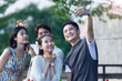 © View Stock - Young people take pictures with their cell phones