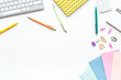 © 9dreamstudio - Creative mess on student's desk. Keyboard, notebook, stationery, on white background top view copy space