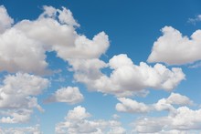 Cumulus Clouds Against Blue Sky