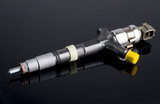 Fototapeta  - Diesel fuel injector isolated on black